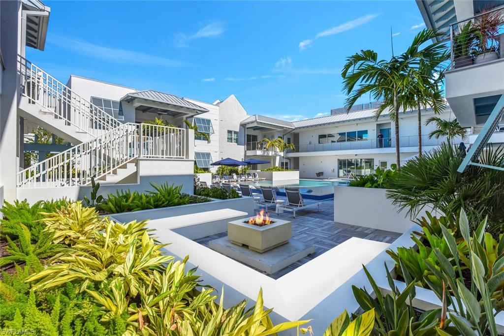 201 8th Street South, Unit 310 Naples, FL 34102 - Photo 29 of 39 a view of a house with garden and sitting area