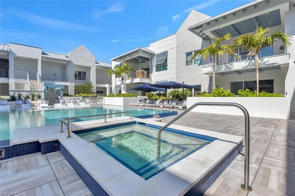 a view of a swimming pool with a patio