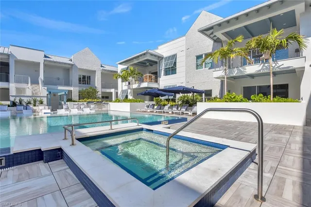 a view of a swimming pool with a patio