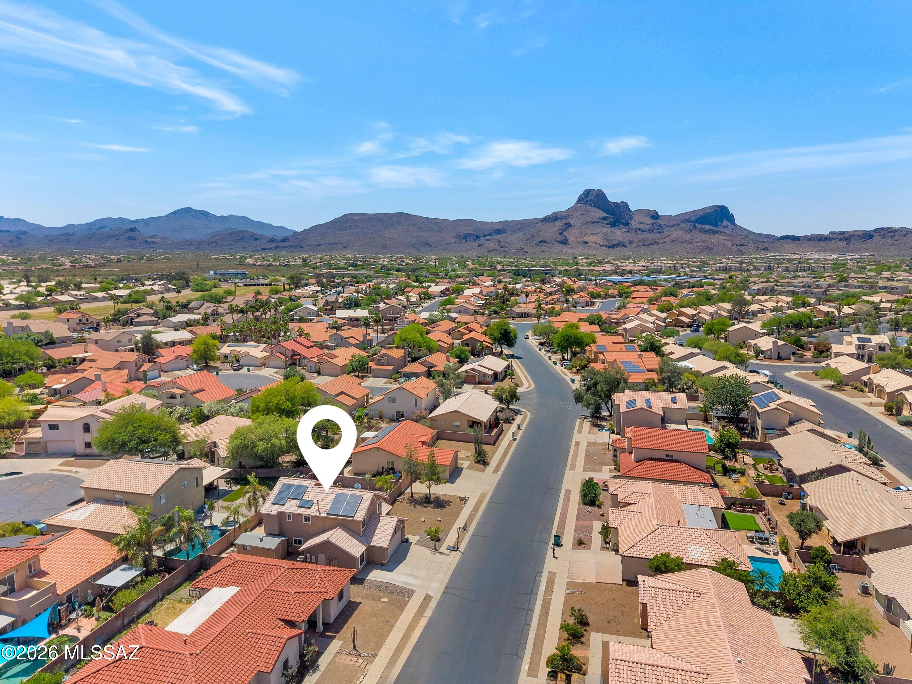 7159 West Maple Ridge Drive Tucson, AZ 85743 - Photo 31 of 42 a view of a city with mountains in the background