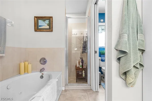 a bathroom with a tub and shower