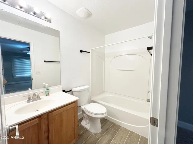a bathroom with a toilet a sink and a bathtub
