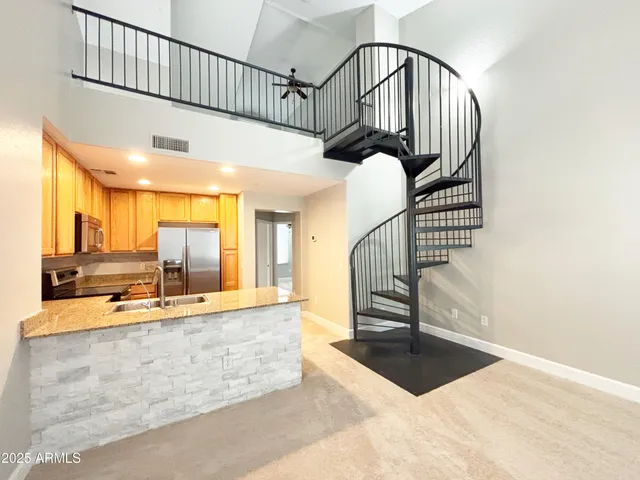 a view of a hallway with staircase