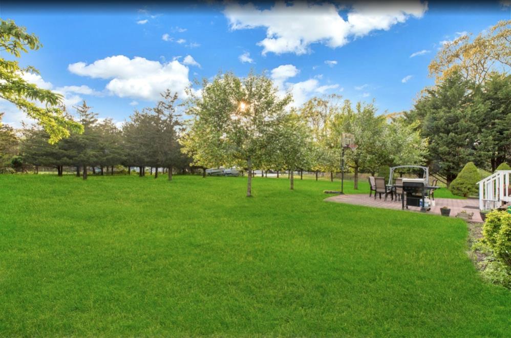 2655 Rocky Point Road East Marion, NY 11939 - Photo 16 of 23 View of yard featuring a patio