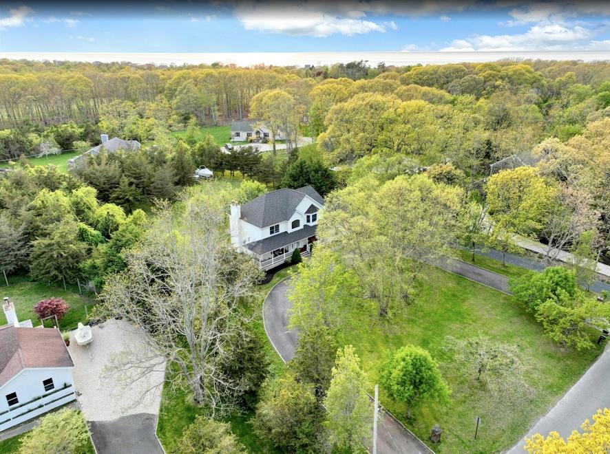 2655 Rocky Point Road East Marion, NY 11939 - Photo 21 of 23 Birds eye view of property featuring a view of trees