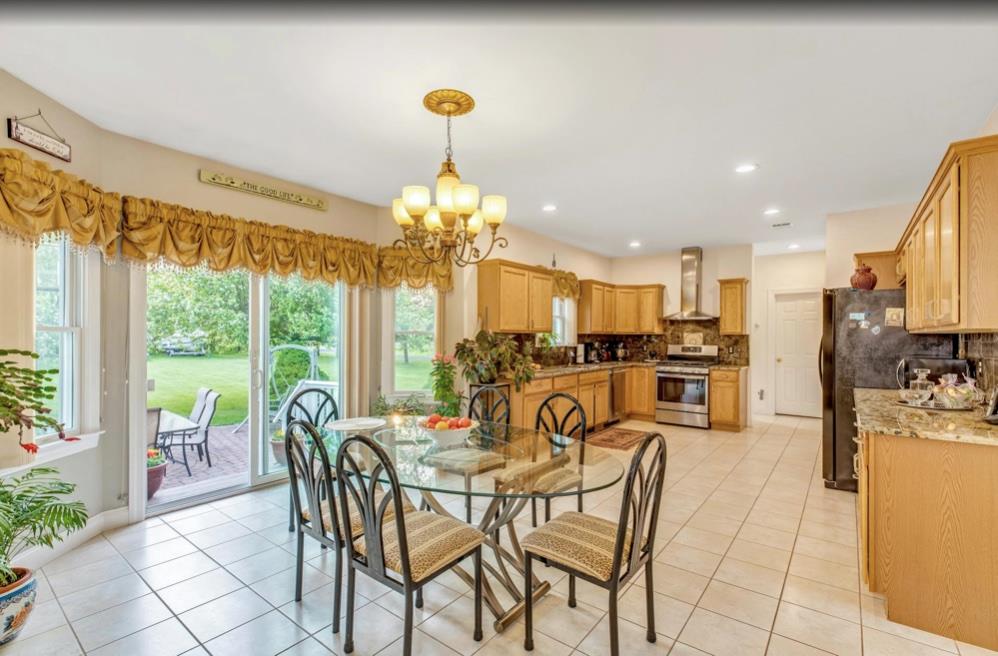 2655 Rocky Point Road East Marion, NY 11939 - Photo 7 of 23 Dining room with an inviting chandelier, recessed lighting, and light tile patterned floors