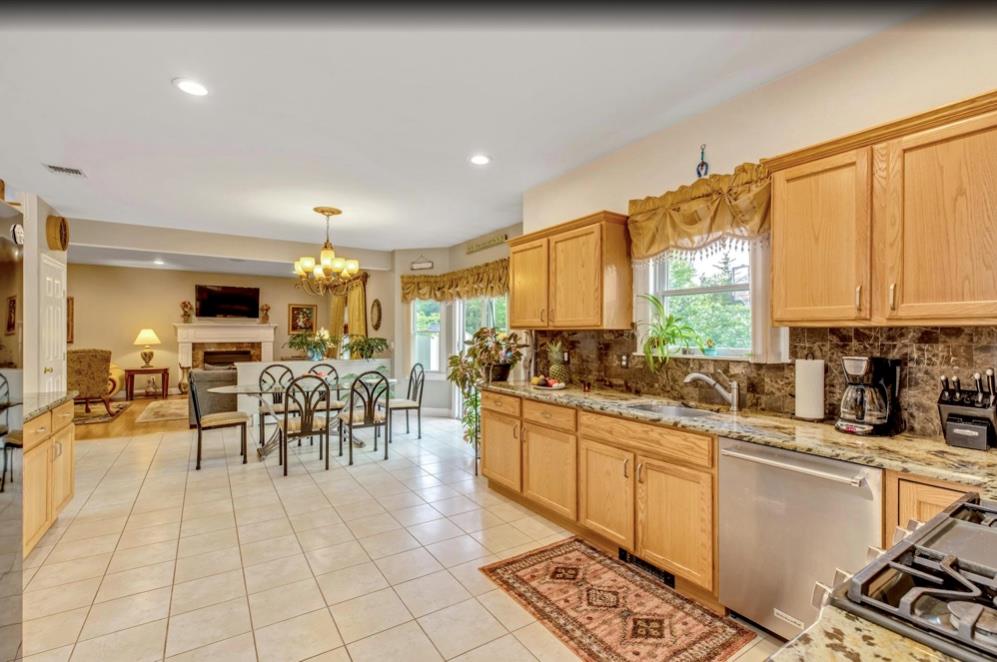2655 Rocky Point Road East Marion, NY 11939 - Photo 8 of 23 Kitchen featuring decorative backsplash, a wealth of natural light, visible vents, and dishwasher