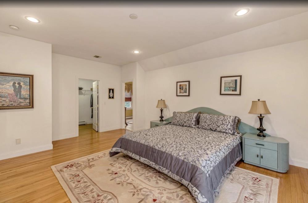 2655 Rocky Point Road East Marion, NY 11939 - Photo 10 of 23 Bedroom with recessed lighting, baseboards, a baseboard radiator, and light wood finished floors