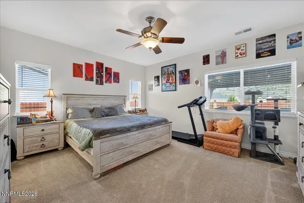 a bedroom with furniture and white walls