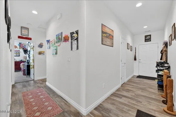 a view of a hallway with paintings on the wall