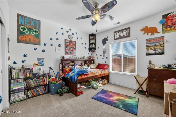 a room with furniture toys and a window