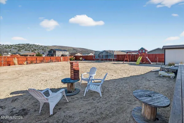 a view of a terrace with furniture and stove