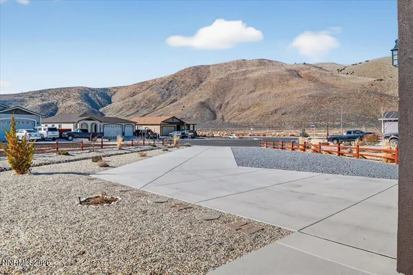 a view of multiple houses with a street