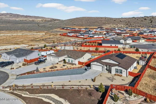 an aerial view of residential houses with outdoor space