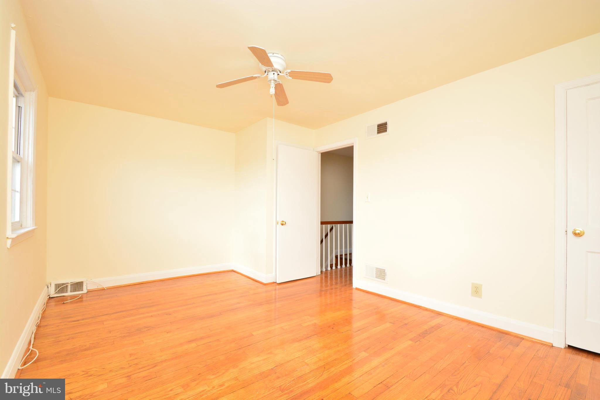 2859 Plainfield Road Dundalk, MD 21222 - Photo 14 of 24 a view of empty room with wooden floor