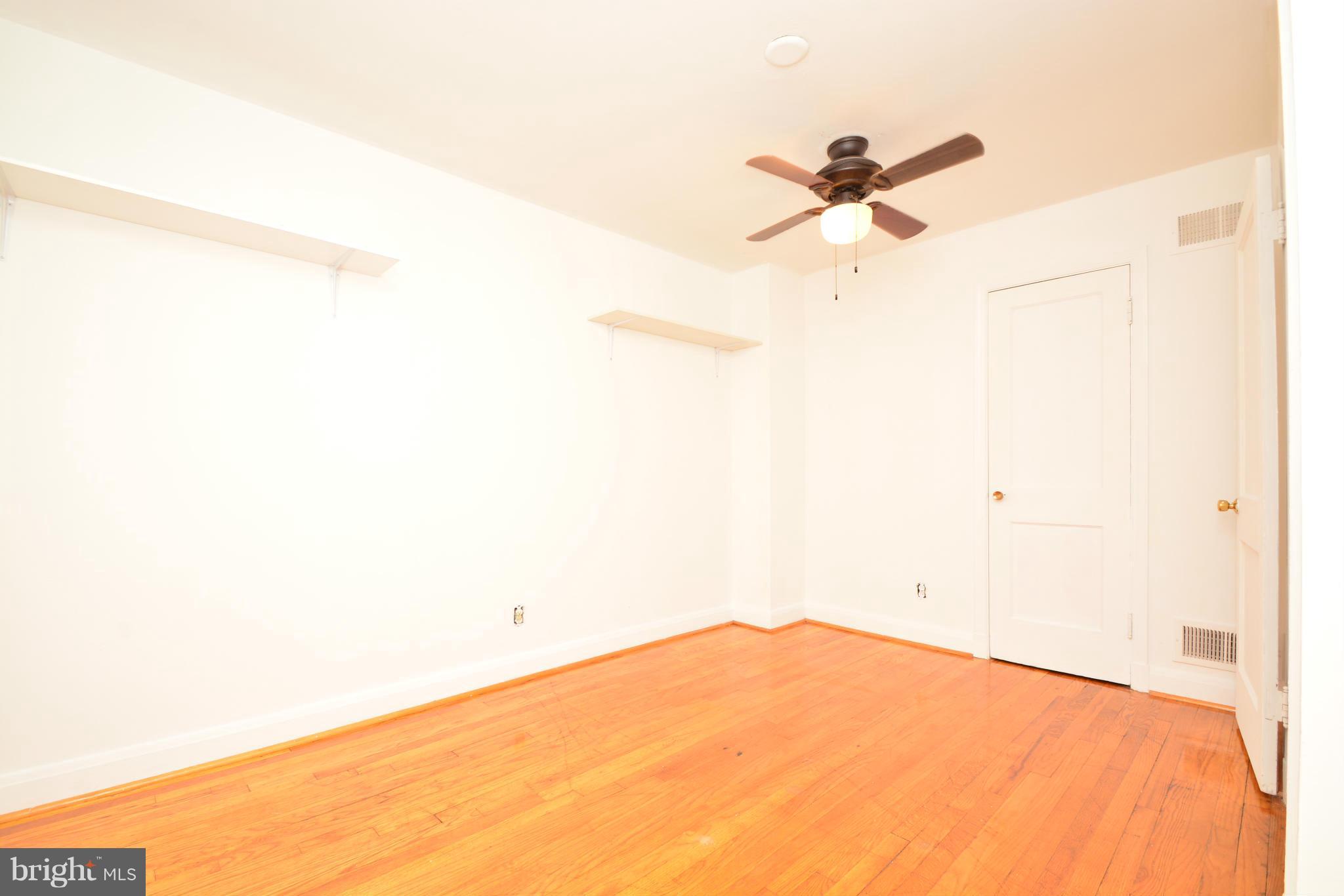 2859 Plainfield Road Dundalk, MD 21222 - Photo 16 of 24 a view of a room with a ceiling fan and a window