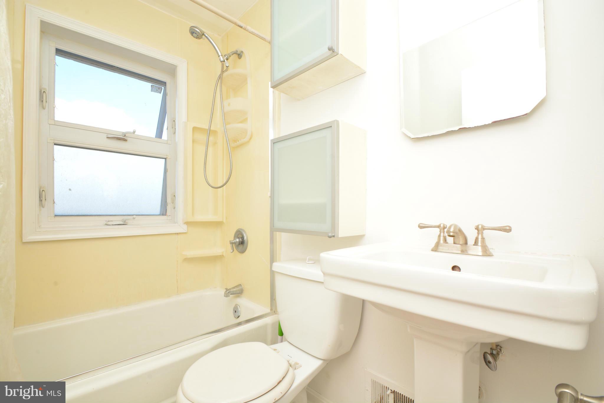 2859 Plainfield Road Dundalk, MD 21222 - Photo 17 of 24 a bathroom with a sink toilet and shower