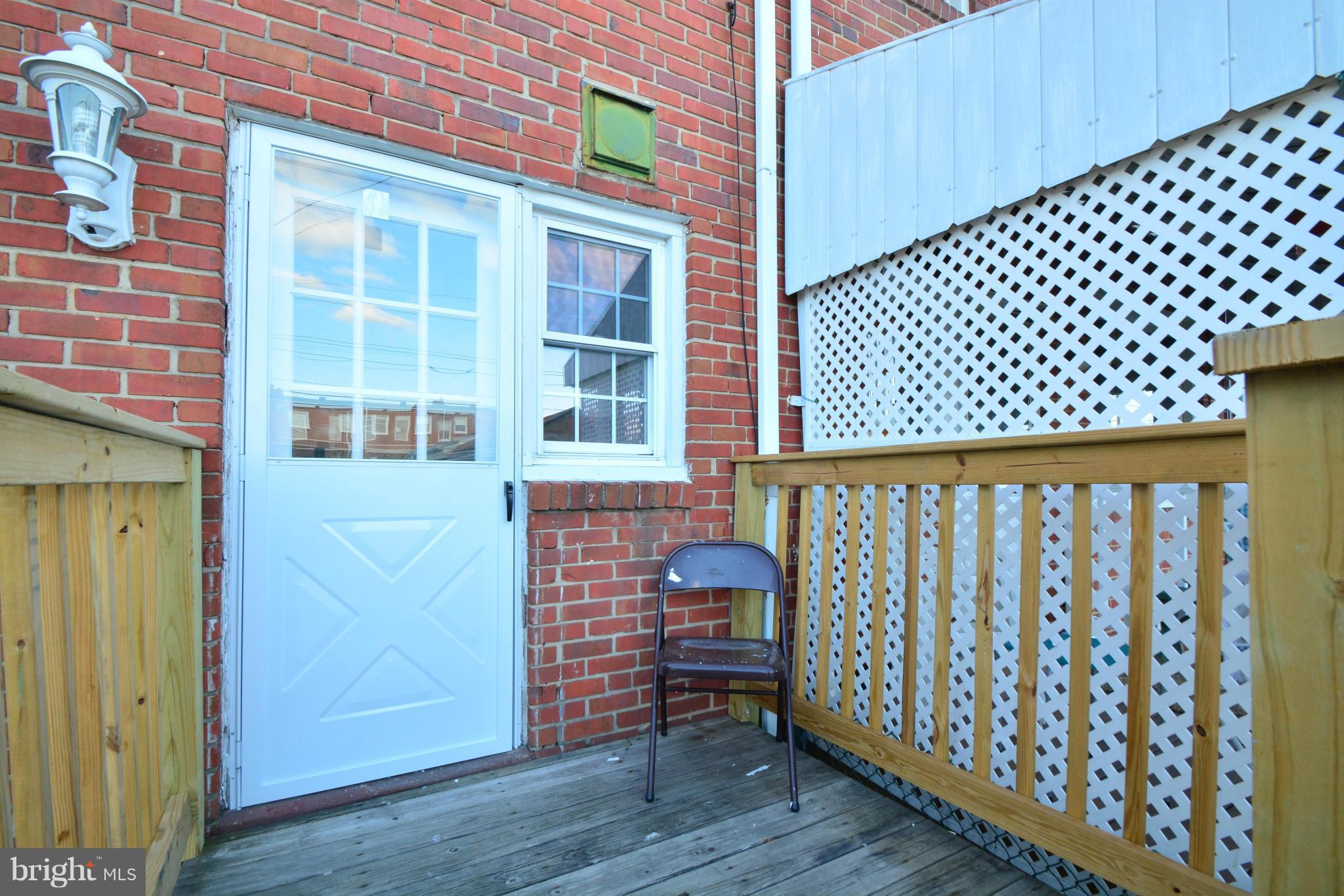 2859 Plainfield Road Dundalk, MD 21222 - Photo 24 of 24 a view of wooden door and a wooden bench