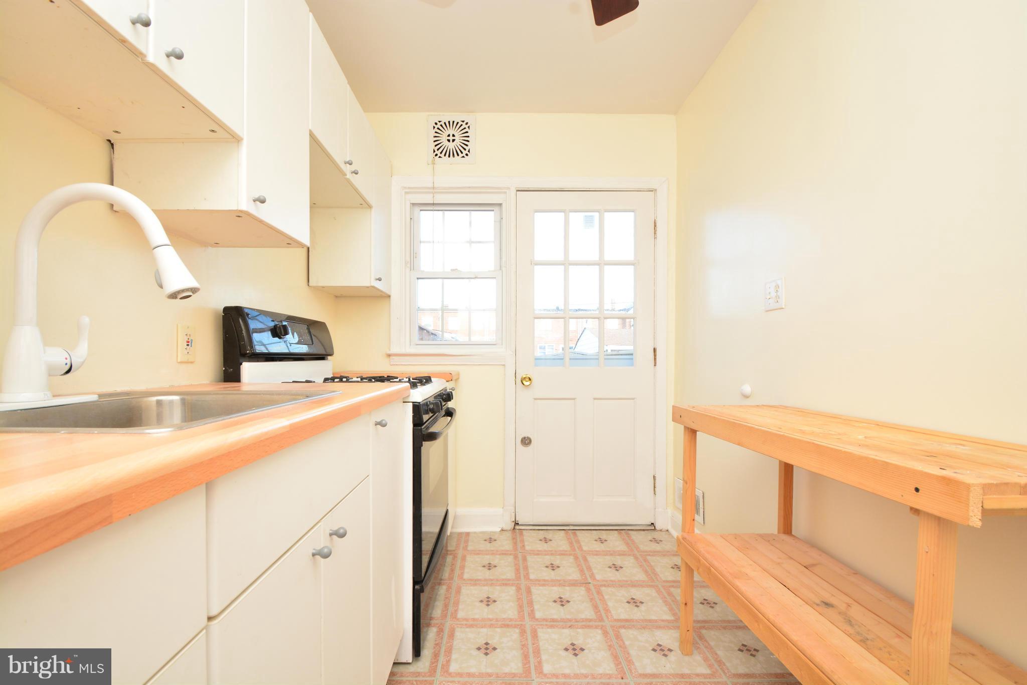 2859 Plainfield Road Dundalk, MD 21222 - Photo 8 of 24 a kitchen with a sink and a window