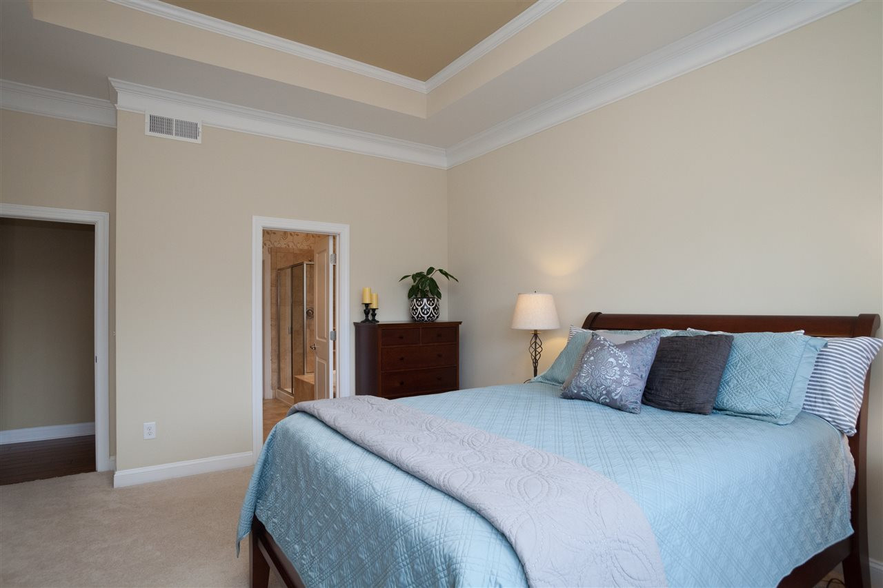 1410 Van Page Boulevard Raleigh, NC 27607 - Photo 12 of 25 TRAY CEILING, CUSTOM PAINT AND PRIVATE ENTRANCE OFF KITCHEN MAKE THIS MASTER SUITE AN OASIS! Master Bedroom