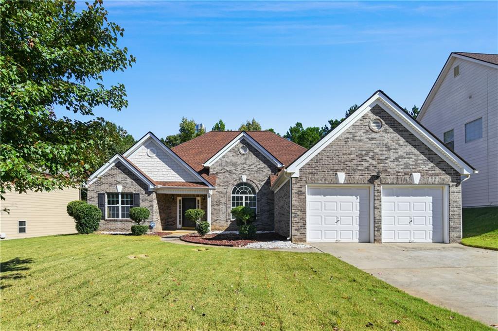 a view of house with yard and entertaining space
