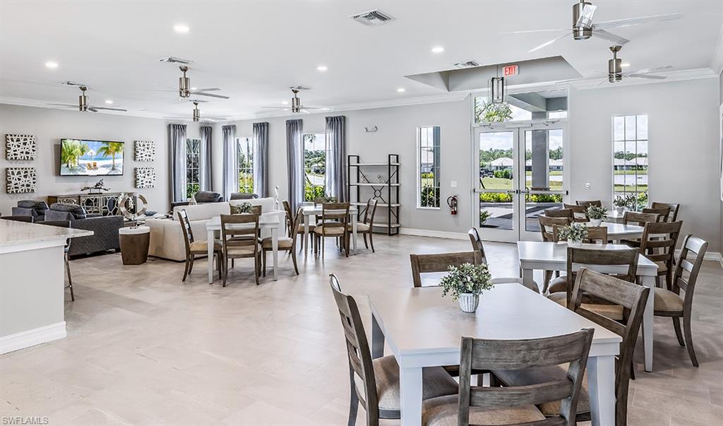 842 Enbrook Loop Naples, FL 34114 - Photo 20 of 23 a view of a dining room with furniture window and outside view