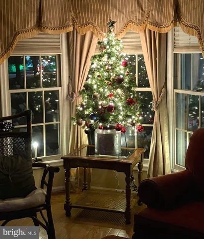 a balcony with table and chairs