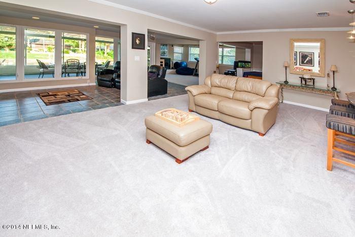 3345 Eunice Road Jacksonville, FL 32250 - Photo 11 of 21 a living room with furniture and a large window