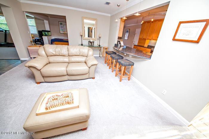 3345 Eunice Road Jacksonville, FL 32250 - Photo 12 of 21 a living room with furniture and a table