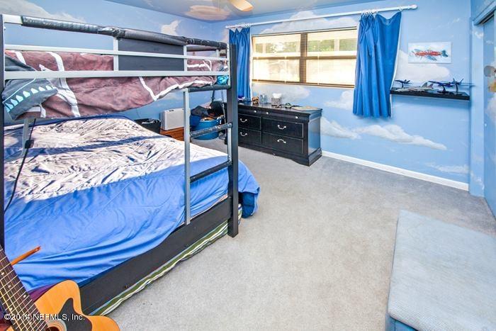 3345 Eunice Road Jacksonville, FL 32250 - Photo 15 of 21 a bedroom with a bed and window