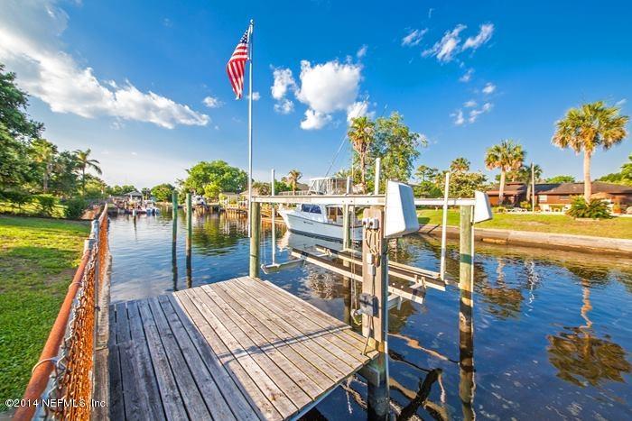3345 Eunice Road Jacksonville, FL 32250 - Photo 19 of 21 a view of a swimming pool with a table and chairs