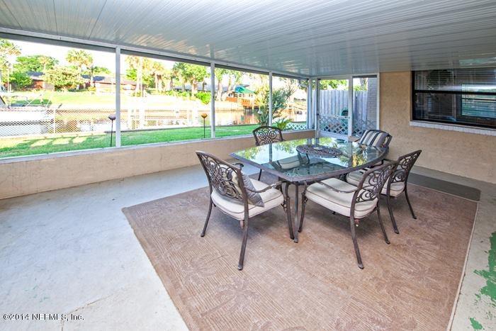 3345 Eunice Road Jacksonville, FL 32250 - Photo 20 of 21 a dining room with furniture and a floor to ceiling window