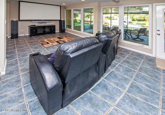 3345 Eunice Road Jacksonville, FL 32250 - Photo 9 of 21 a living room with furniture and a fireplace