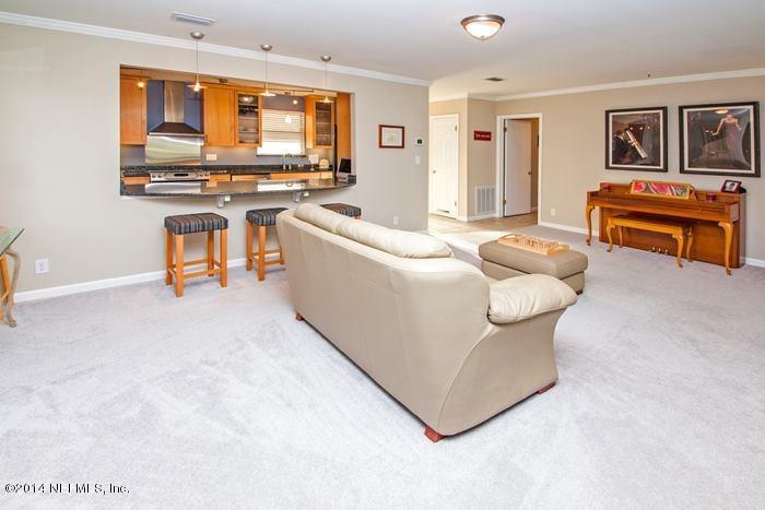 3345 Eunice Road Jacksonville, FL 32250 - Photo 10 of 21 a living room with furniture and a flat screen tv
