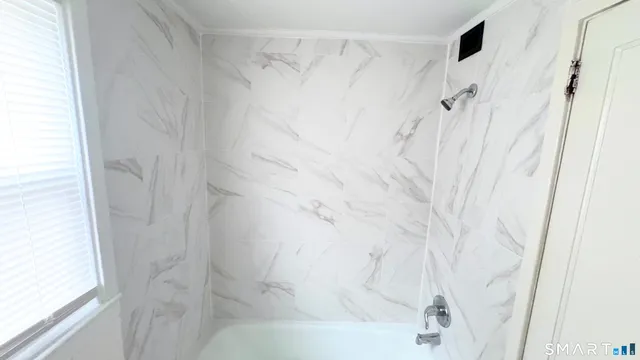 a bathroom with a shower curtain