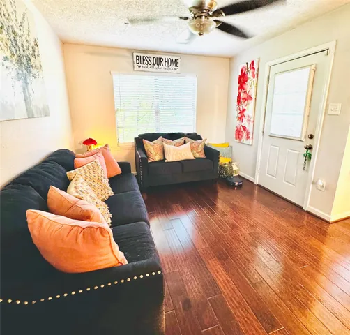 a room with furniture and a wooden floor