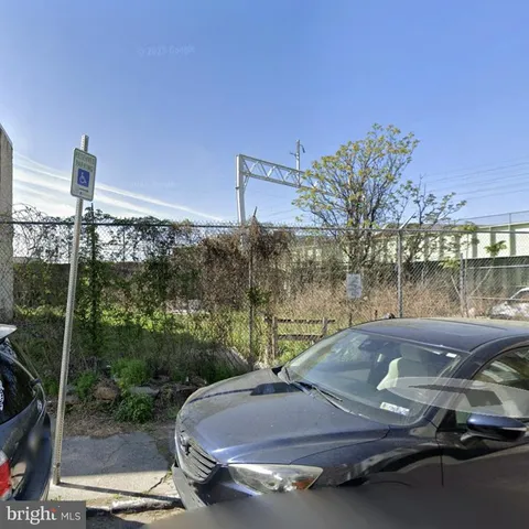 a view of a swimming pool with a yard