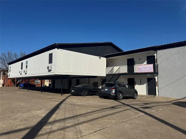 a view of a street with garage
