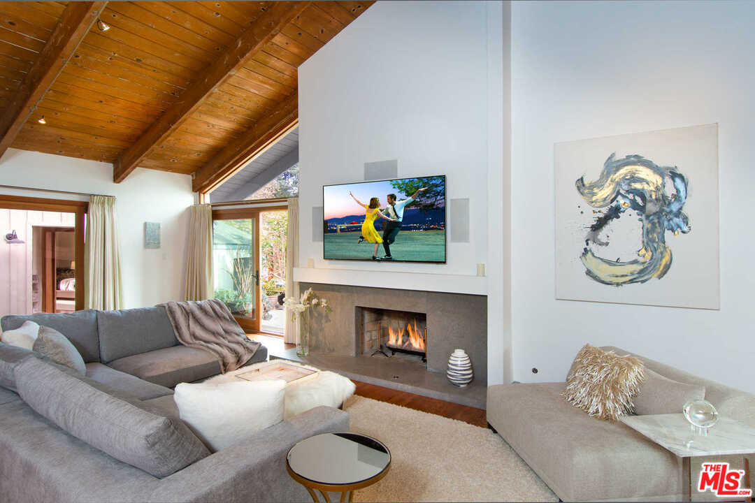 8027 Briar Summit Drive Los Angeles, CA 90046 - Photo 11 of 43 a living room with furniture and a fireplace