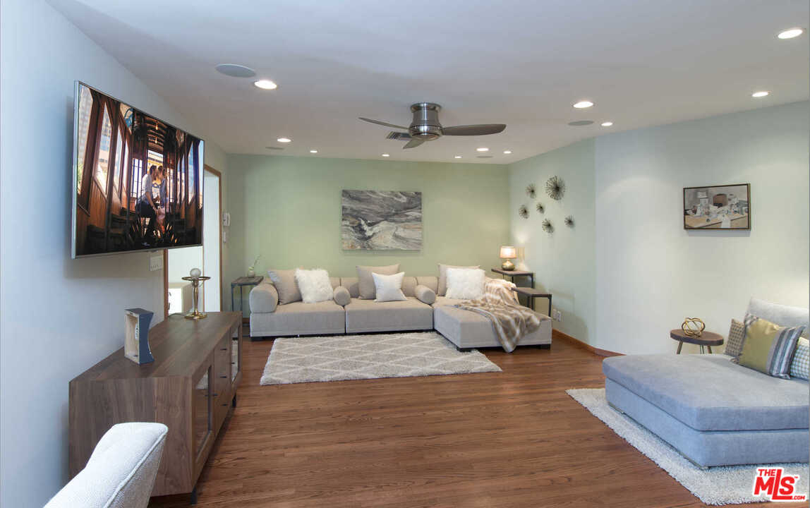 8027 Briar Summit Drive Los Angeles, CA 90046 - Photo 23 of 43 a living room with furniture and a flat screen tv