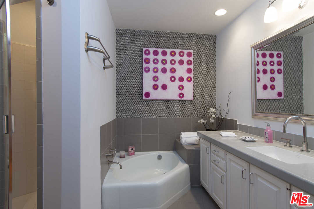 8027 Briar Summit Drive Los Angeles, CA 90046 - Photo 27 of 43 a bathroom with a sink and a mirror