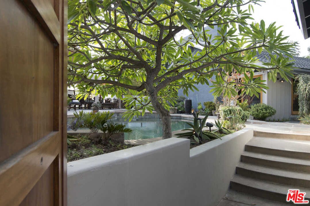 8027 Briar Summit Drive Los Angeles, CA 90046 - Photo 4 of 43 a view of a bench in a back yard
