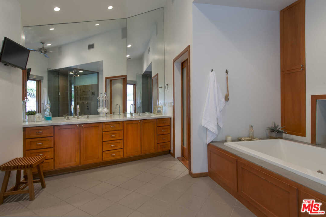 8027 Briar Summit Drive Los Angeles, CA 90046 - Photo 32 of 43 a large bathroom with a large tub and sink