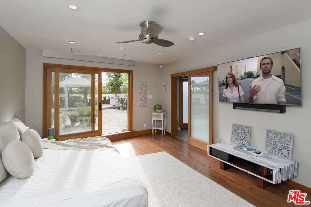 8027 Briar Summit Drive Los Angeles, CA 90046 - Photo 39 of 43 a bedroom with furniture and a large window