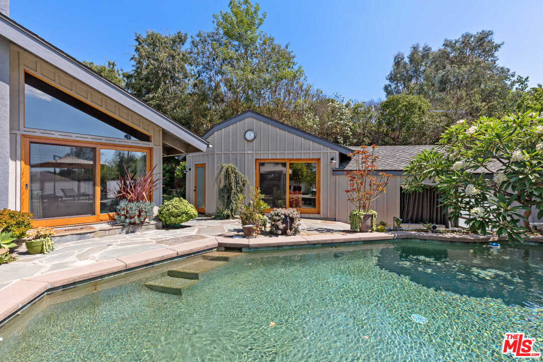 8027 Briar Summit Drive Los Angeles, CA 90046 - Photo 8 of 43 a front view of house with yard and outdoor seating