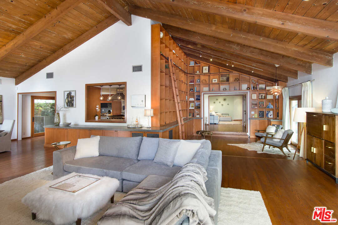 8027 Briar Summit Drive Los Angeles, CA 90046 - Photo 9 of 43 a living room with furniture and a large window