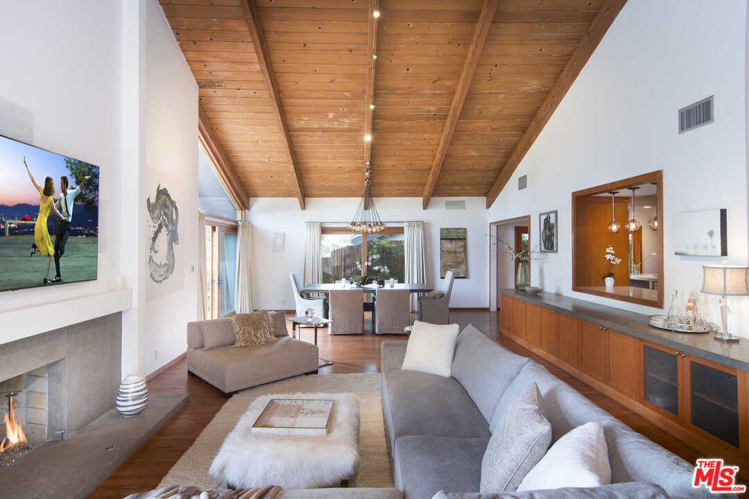 8027 Briar Summit Drive Los Angeles, CA 90046 - Photo 10 of 43 a living room with furniture and a large window