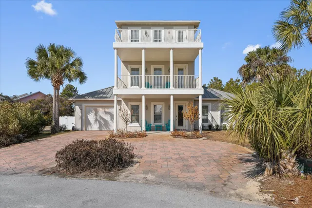 a kitchen that has a sink a stove and window