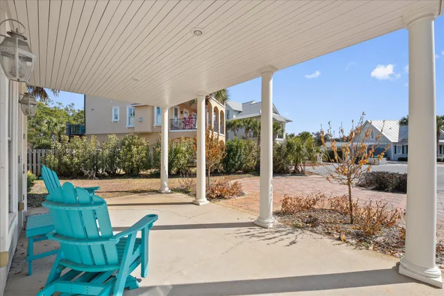 a living room with furniture and a lamp