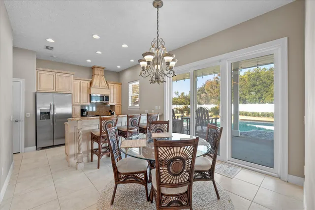 a en suite bathroom with a granite countertop sink a mirror and vanity